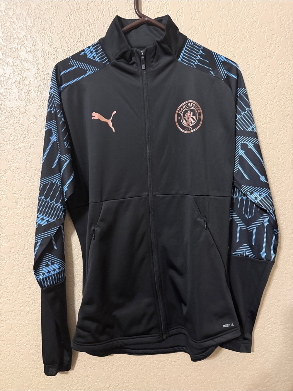 Puma Black Jacket with Light Blue Patterned Sleeves and Pink Accents